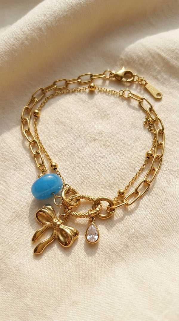 Azure Bow Charm Strand Bracelet